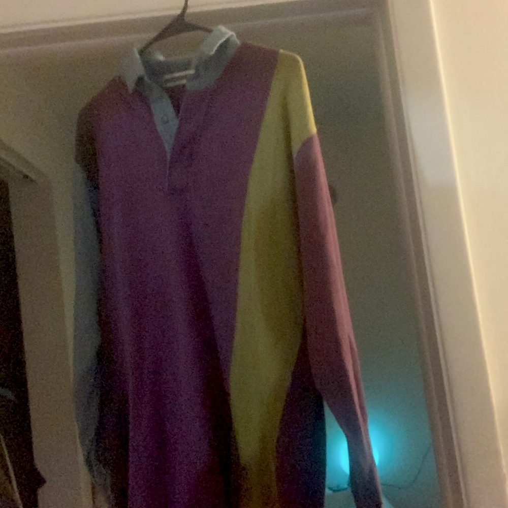 A cool colored long sleeve 3 button collared.